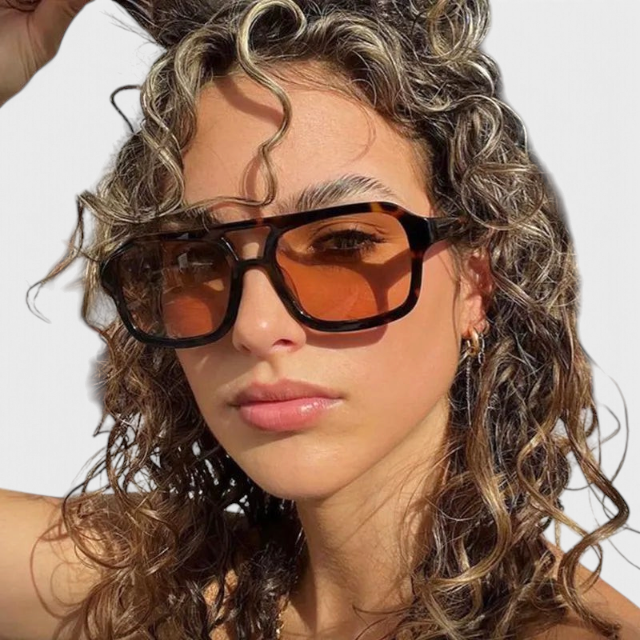 Beach Rose Co. vintage-inspired oversized square sunglasses with a tortoiseshell frame and amber lenses on a model.