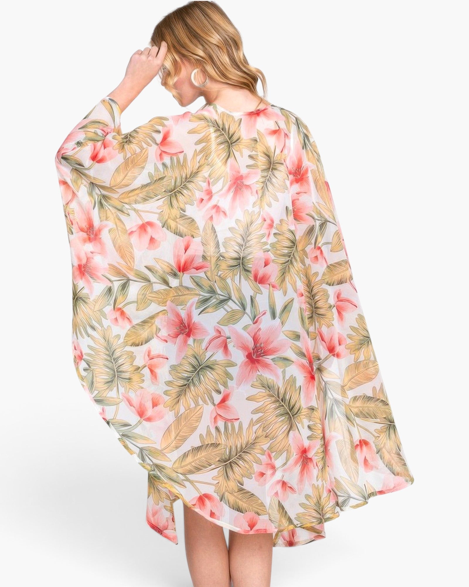 Beach Rose Co. tropical floral print shawl cover-up with a lightweight, airy drape worn by a blonde woman.