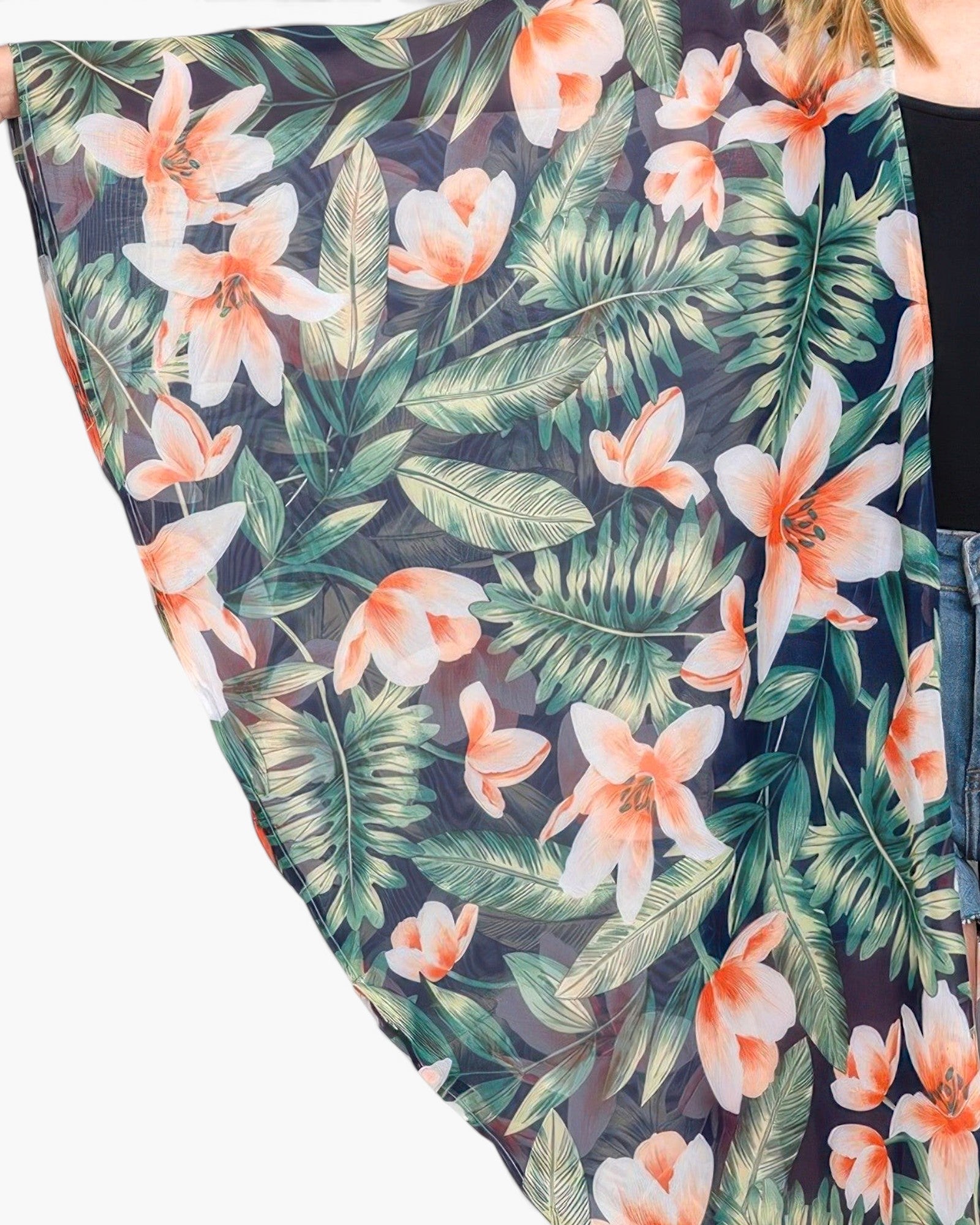 Beach Rose Co. lightweight shawl cover-up featuring a bold tropical flower and green leaves print on dark fabric.