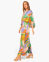 Beach Rose Co. Isla Tropical satin jumpsuit with boat neck, blouson bodice, and vibrant leaf print on a model