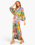 Beach Rose Co. satin jumpsuit with a vibrant tropical print, boat neckline, and blouson sleeves on a female model.