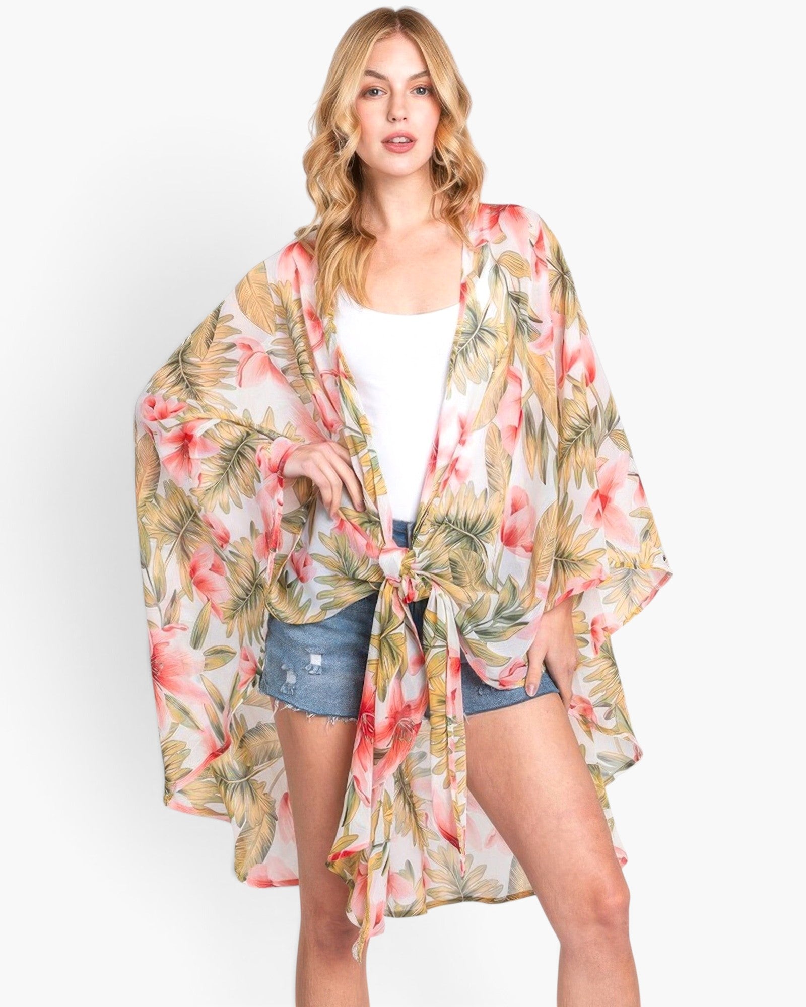 Beach Rose Co. lightweight tropical flower and leaf print shawl cover-up worn by a blonde model over a white tank top.