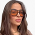 Beach Rose Co. vintage square sunglasses with amber lenses and a double-bridge polycarbonate frame on a woman.