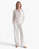 Beach Rose Co. cream waffle knit two-piece set with button-up top and drawstring pants worn by a model