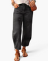 Beach Rose Co. washed black barrel leg jeans with panel detailing and cropped silhouette on a model.