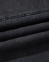 Close-up of Beach Rose Co. washed black cotton blend denim fabric with visible seam detailing and texture.