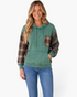 Beach Rose Co. washed green cotton hoodie with brown plaid sleeves, chest pocket, and drawstring hood on a model.