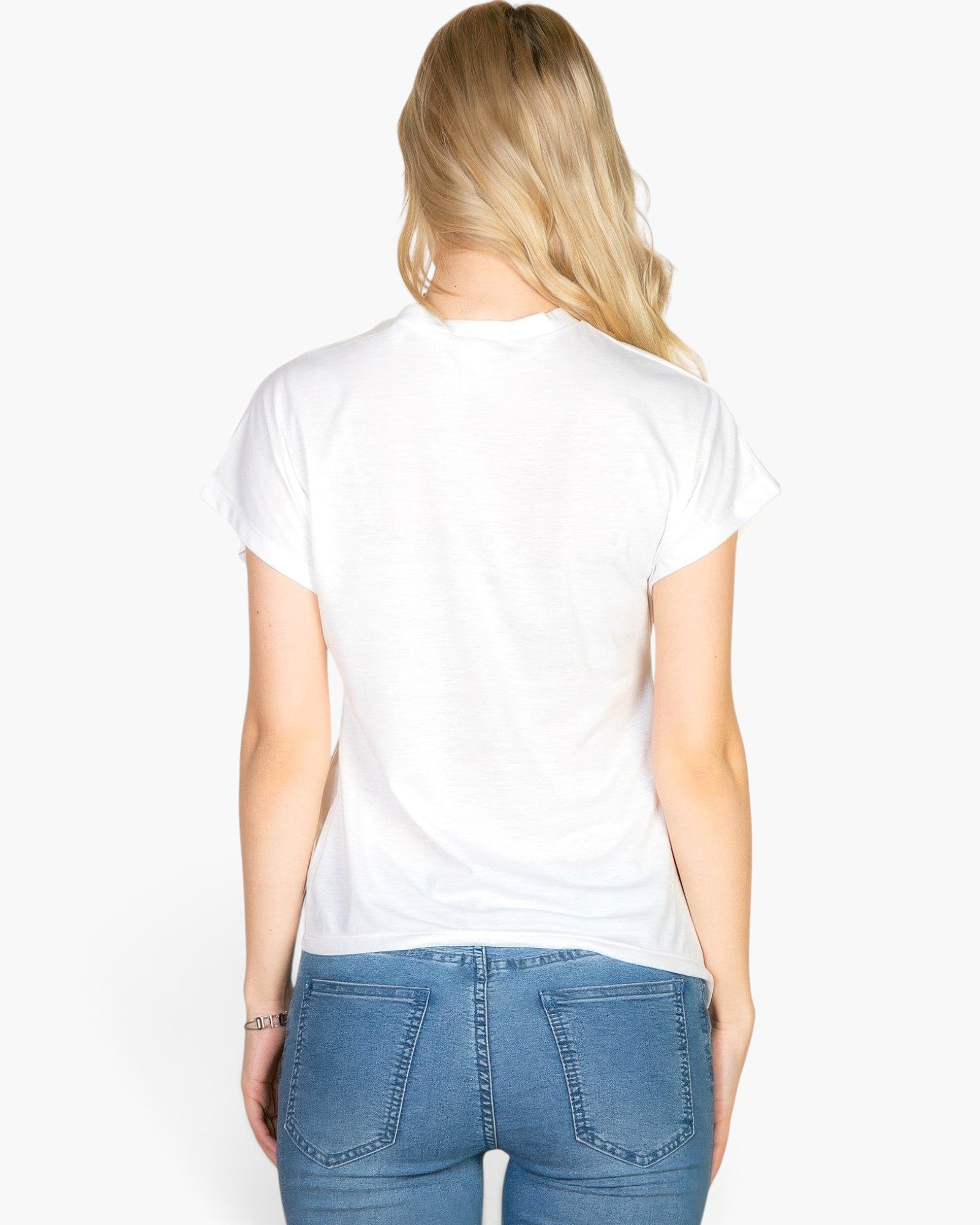 Back view of a blonde woman wearing a white Beach Rose Co. batwing sleeve tee with blue jeans