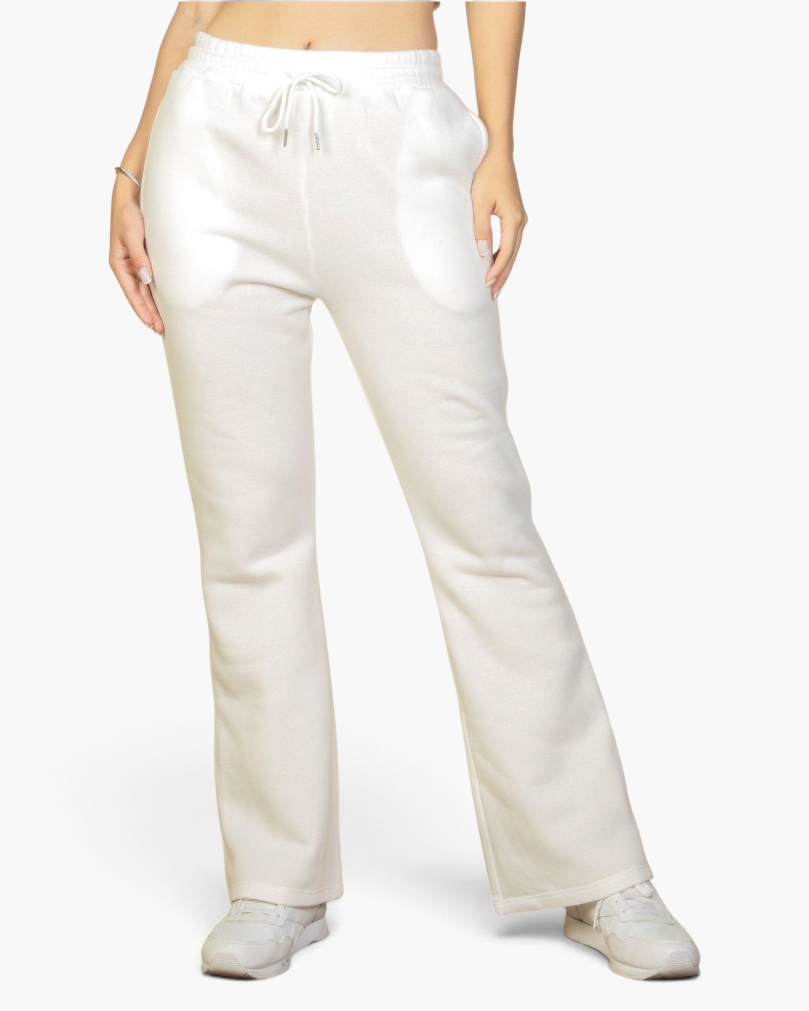 Beach Rose Co. white bootcut sweatpants with a drawstring waist and slant pockets worn by a model.