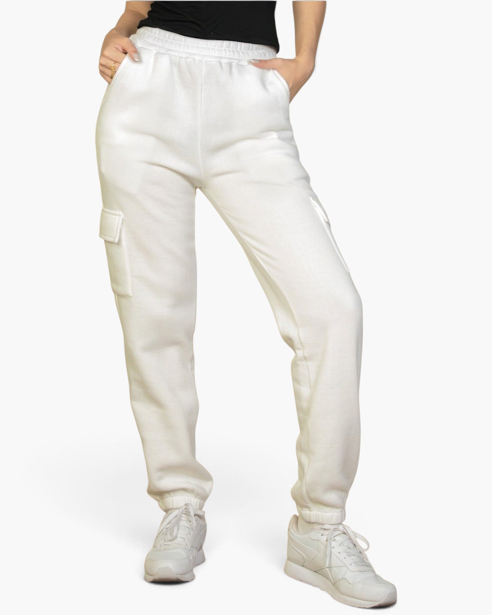 Beach Rose Co. white drawstring sweatpants with side cargo pockets and elastic cuffs worn by a woman