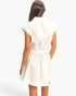 Back view of a Beach Rose Co. white cotton sleeveless mini dress with a collared neckline and shirred waist.