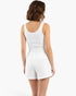 Beach Rose Co. white cotton comfort shorts worn by a woman with a matching ribbed tank top, back view