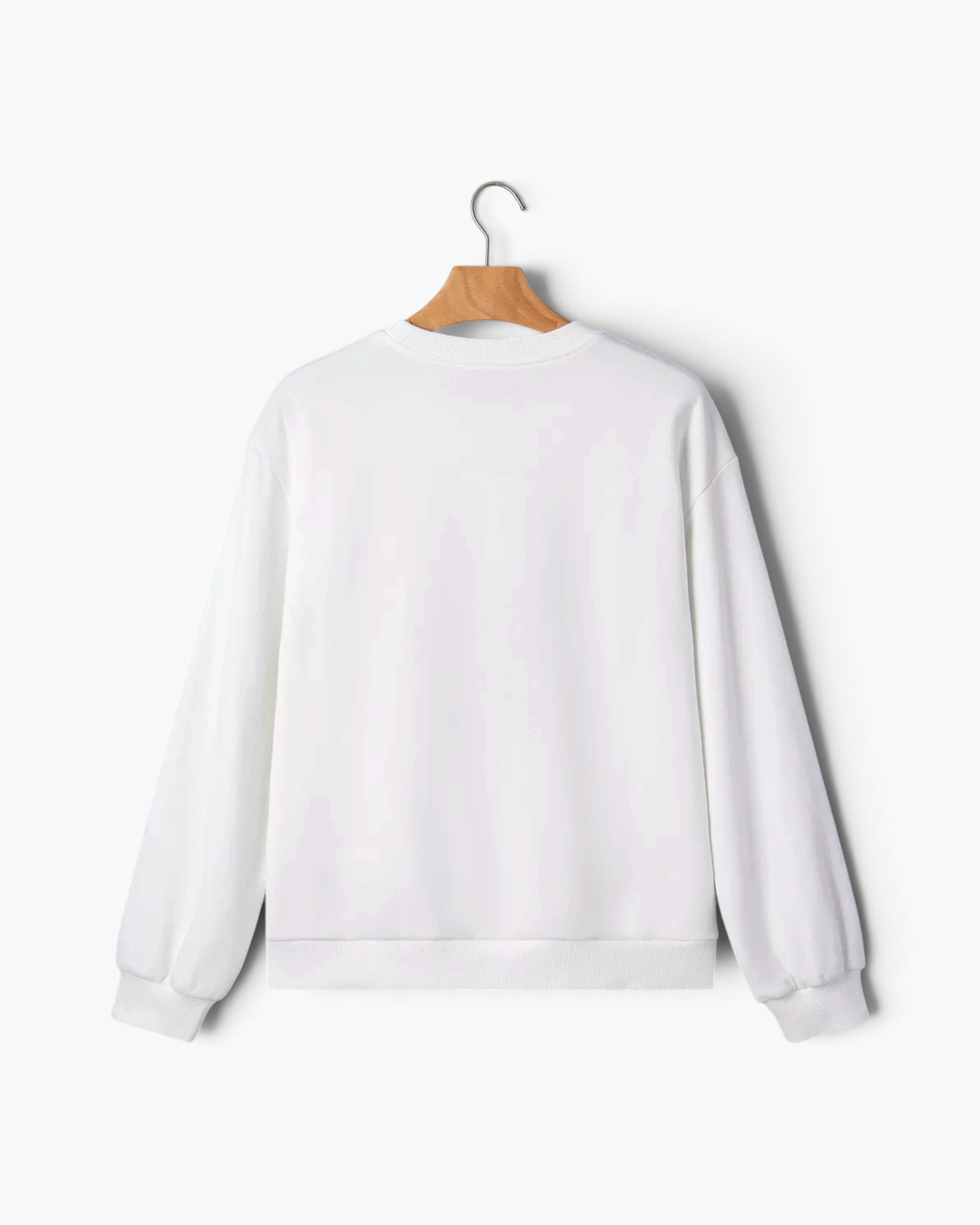 Beach Rose Co. white crewneck sweatshirt with long sleeves and ribbed trim, shown from the back on a wooden hanger.