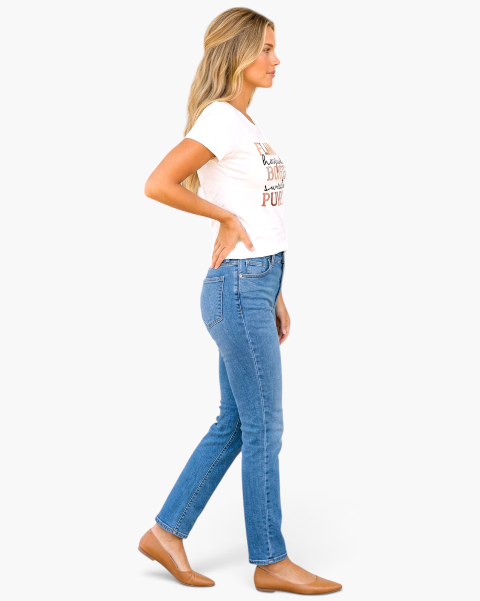 Beach Rose Co. white graphic t-shirt with autumn typography worn by a woman with blue jeans and tan flats