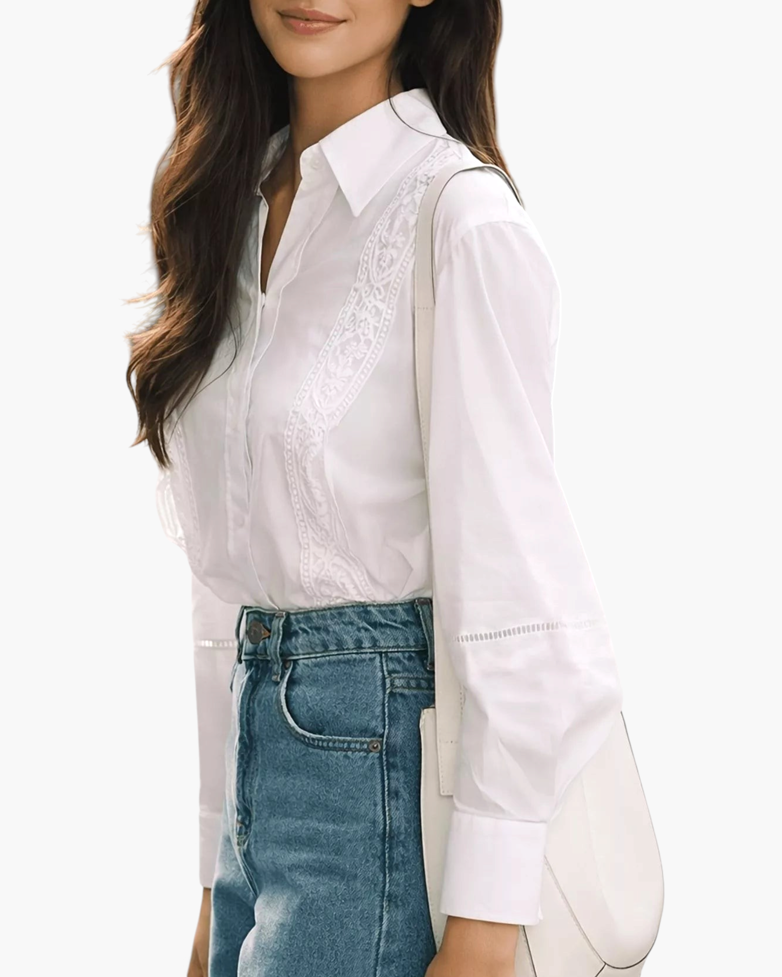 Beach Rose Co. white blouse with floral embroidery, pointed collar, and openwork sleeve details worn with blue jeans.