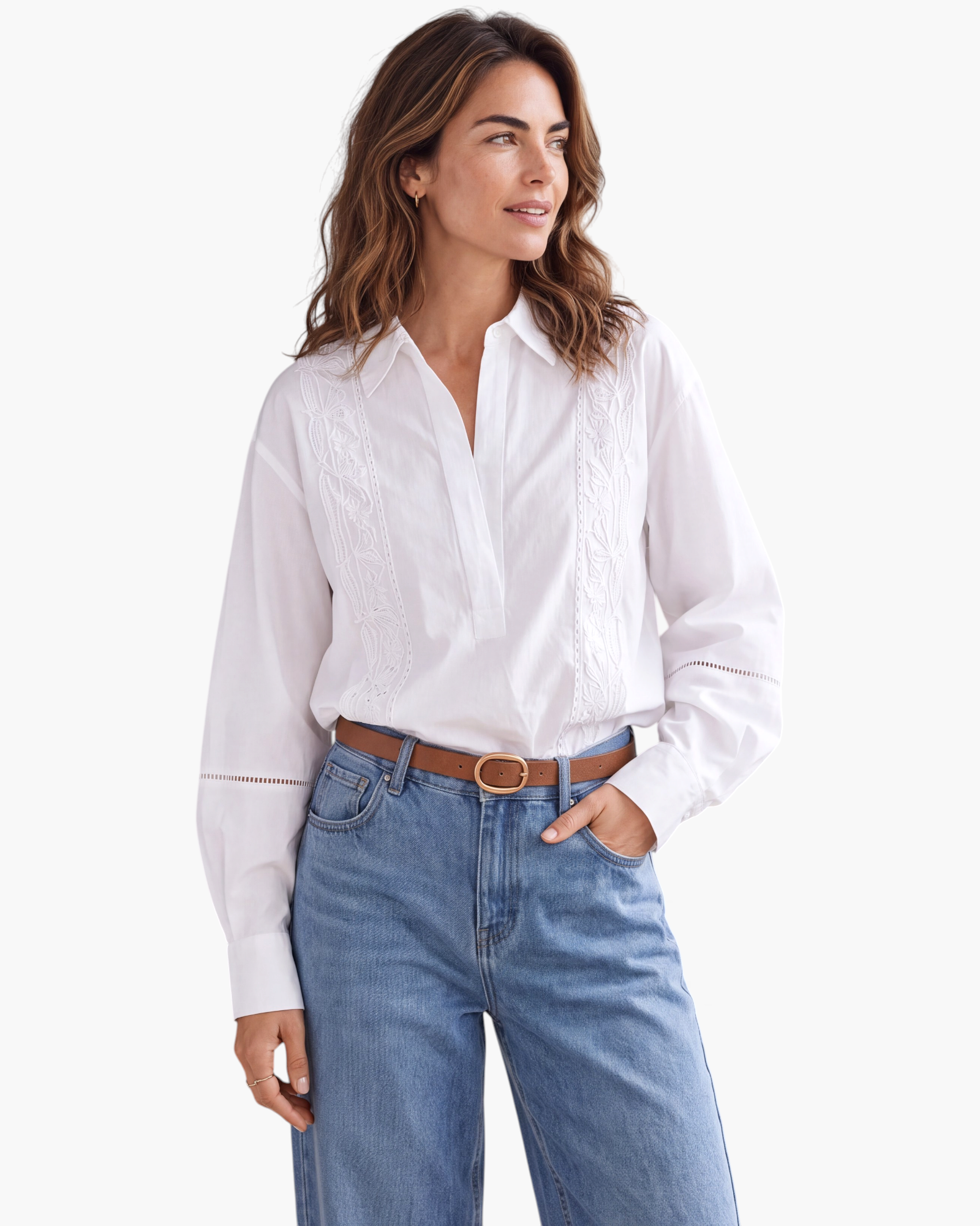 Beach Rose Co. white long-sleeve blouse with floral embroidery, pointed collar, and openwork sleeve details.