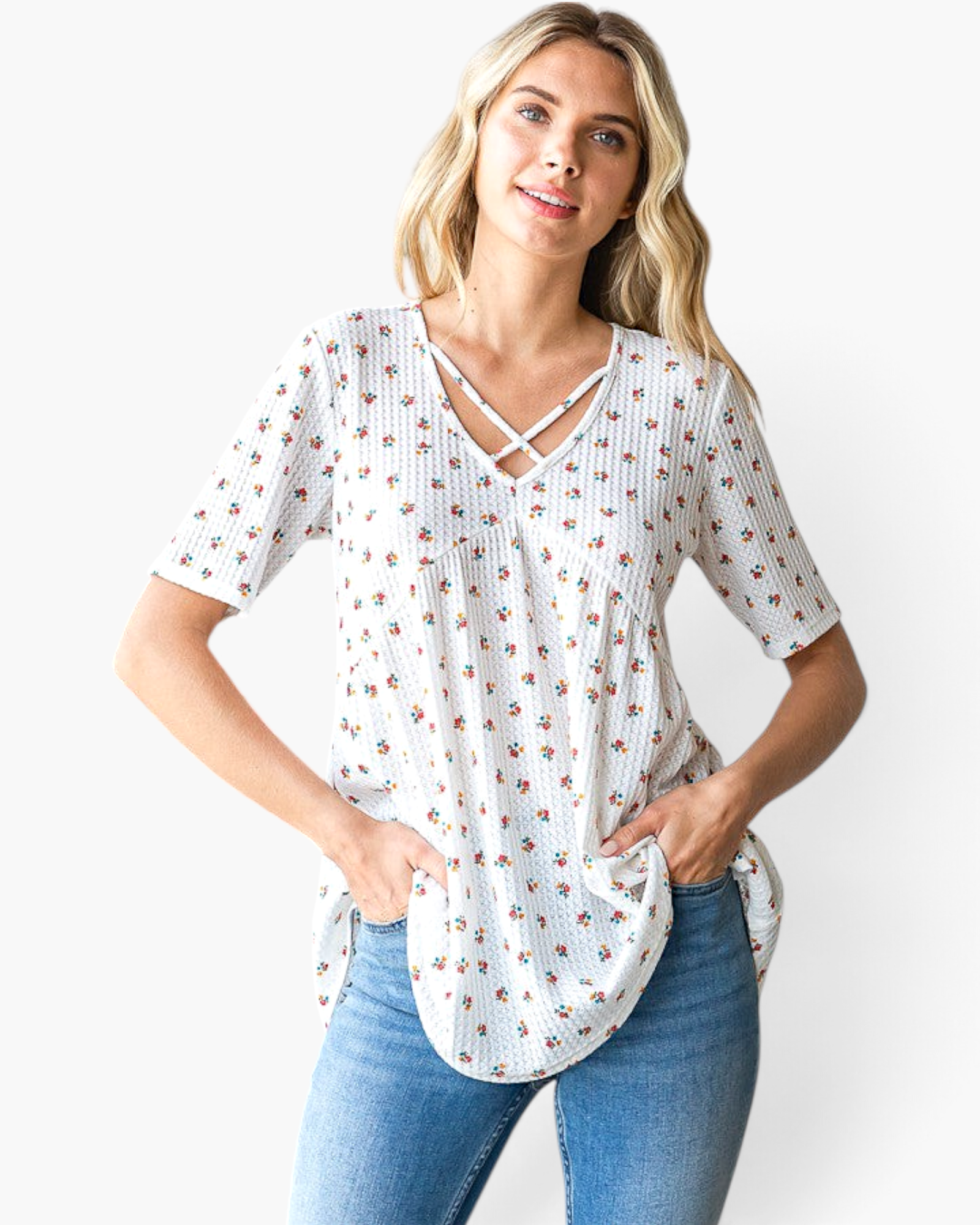 Beach Rose Co. white textured waffle knit tunic with a ditsy floral print and crisscross strap V-neckline