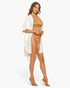 Beach Rose Co. white midi kimono cover-up with flutter sleeves worn over a striped bikini on a model