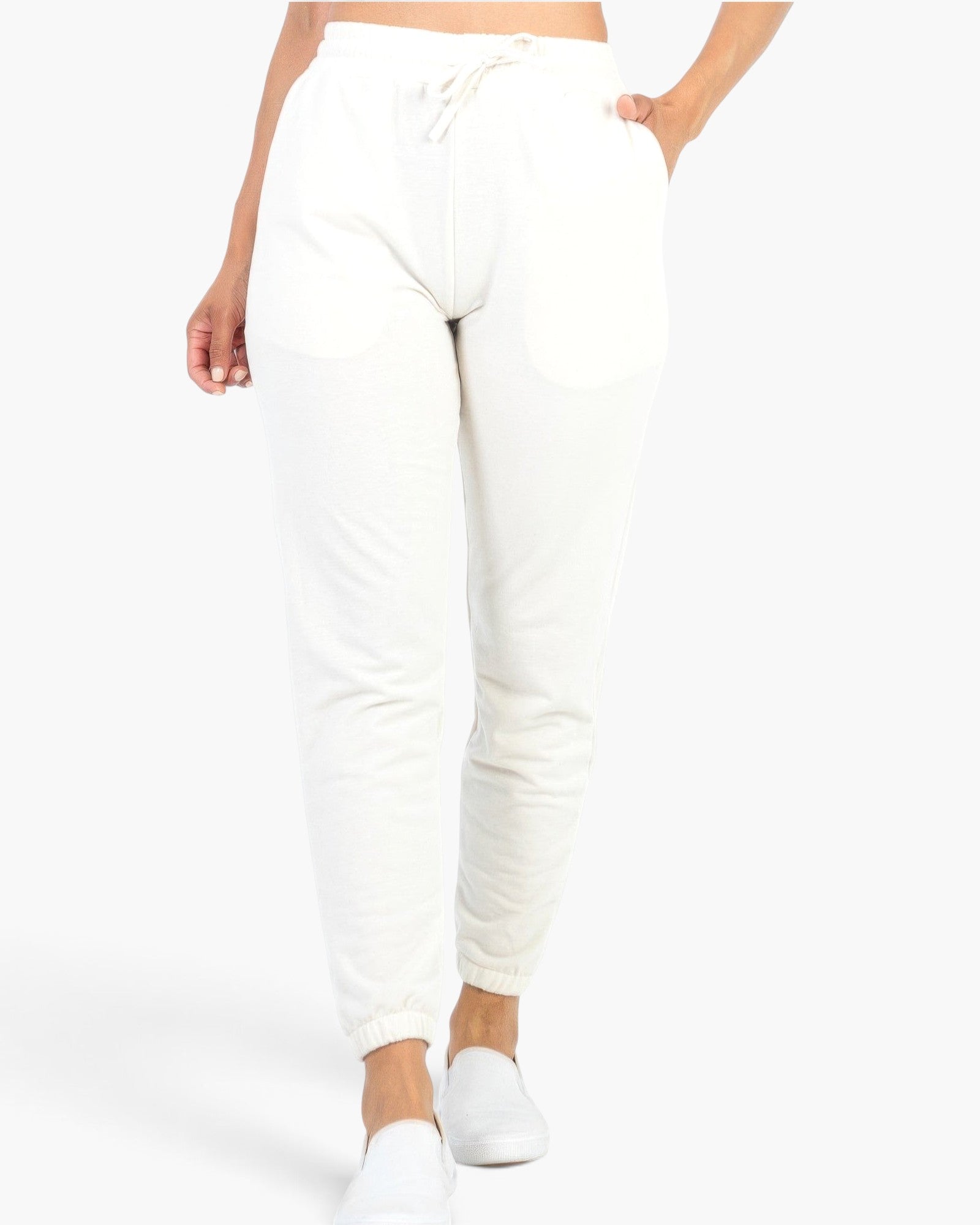 Beach Rose Co. white French Terry jogger pants with an elastic waistband, tapered fit, and side pockets.