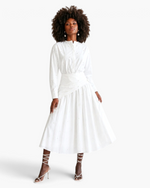 Beach Rose Co. white two-piece set with pearl-embellished long-sleeve blouse and asymmetrical draped midi skirt.