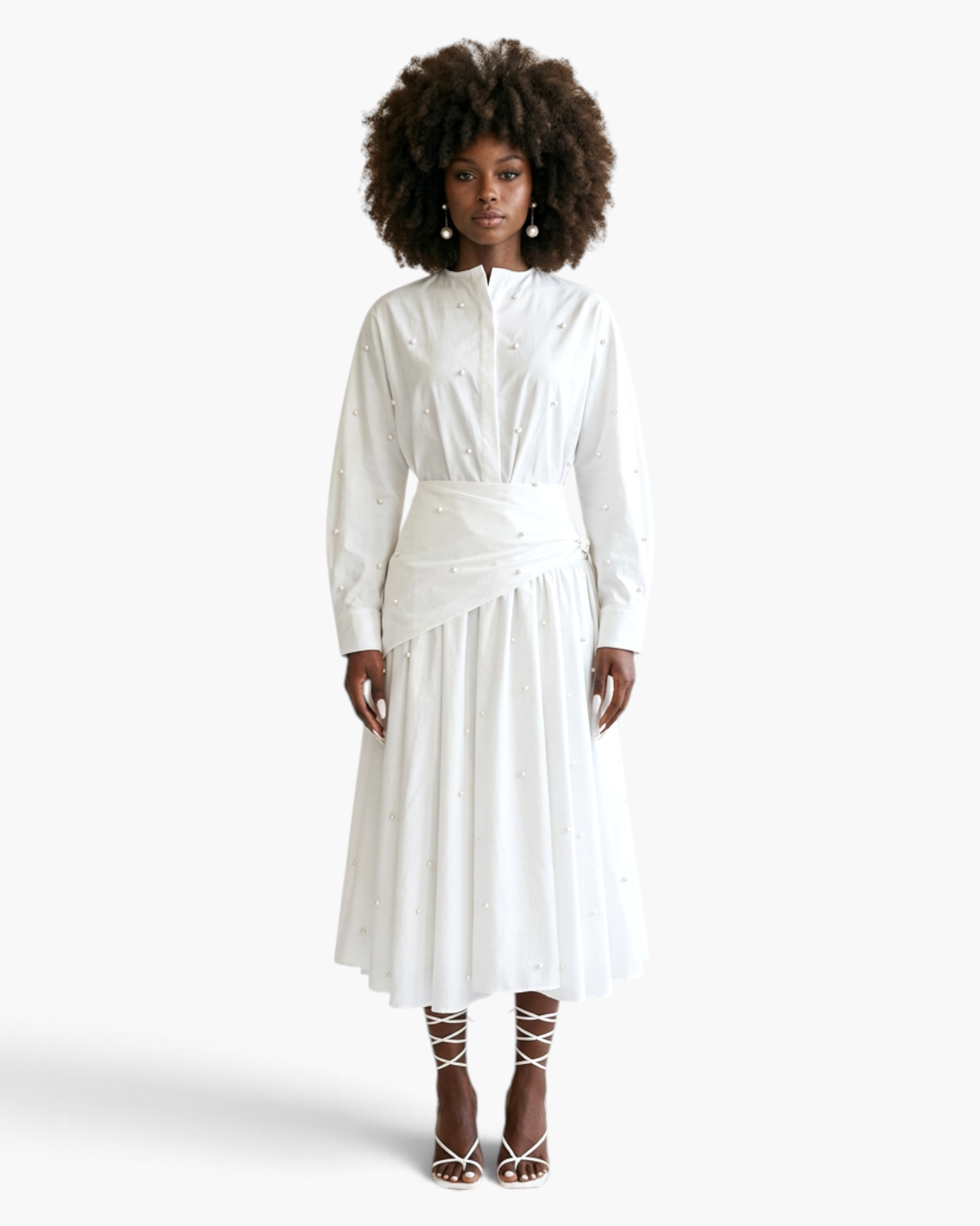 Beach Rose Co. white two-piece set featuring a long-sleeve pearl-embellished blouse and an asymmetrical midi skirt.