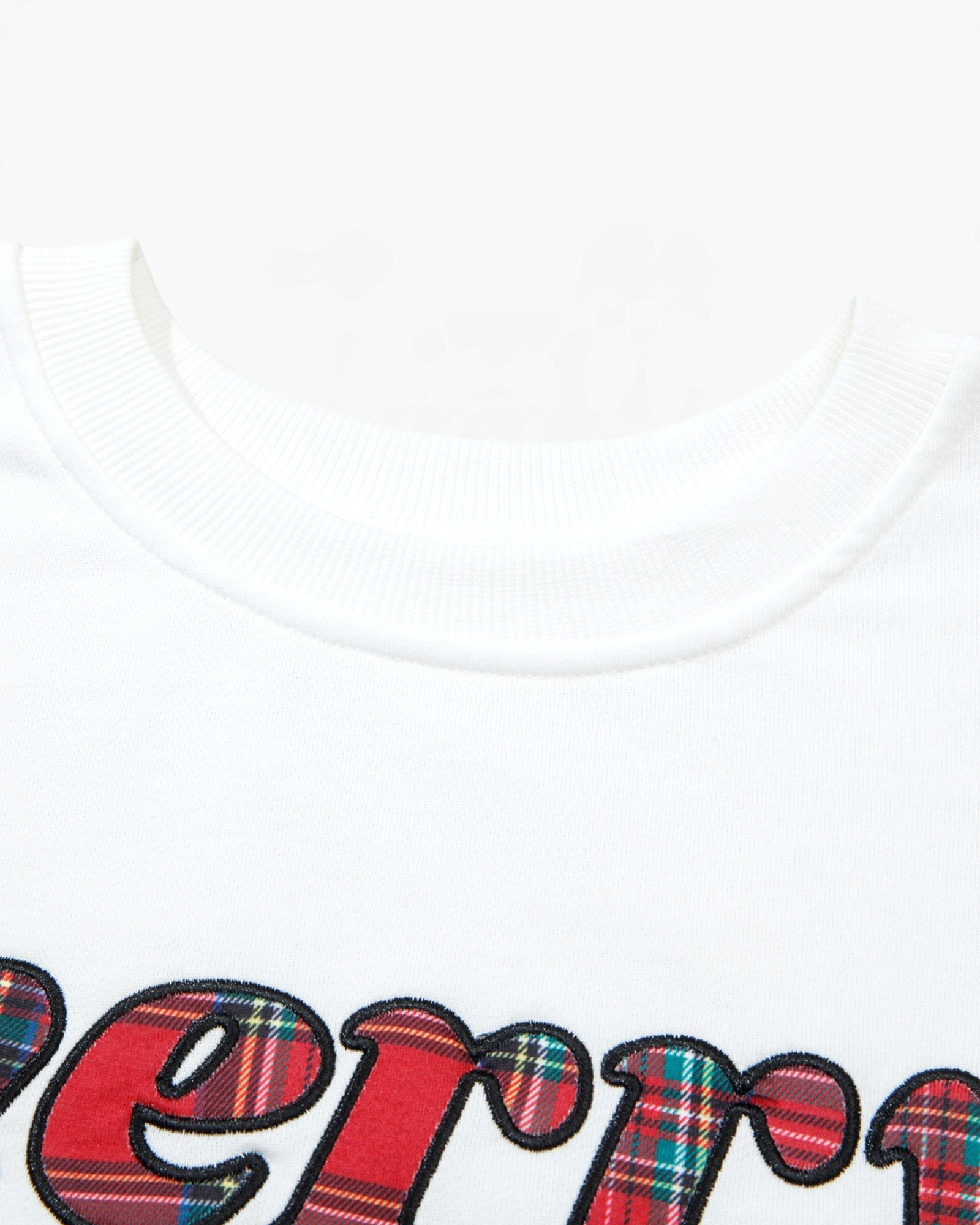 Beach Rose Co. white crewneck lounge top featuring a festive red and green plaid merry graphic on the chest
