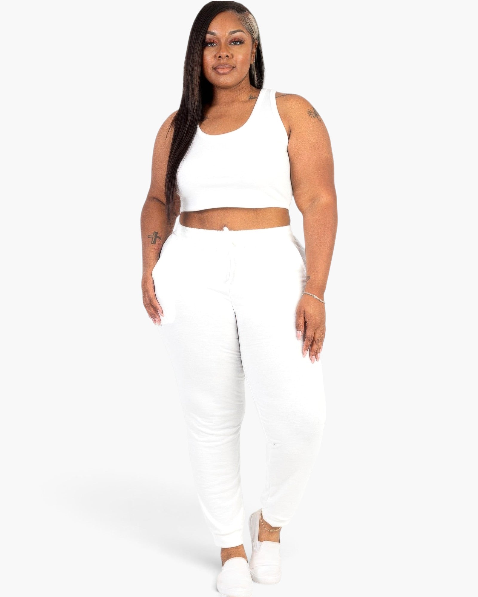 Beach Rose Co. plus size white French terry cropped tank top and joggers set worn by a model on a white background