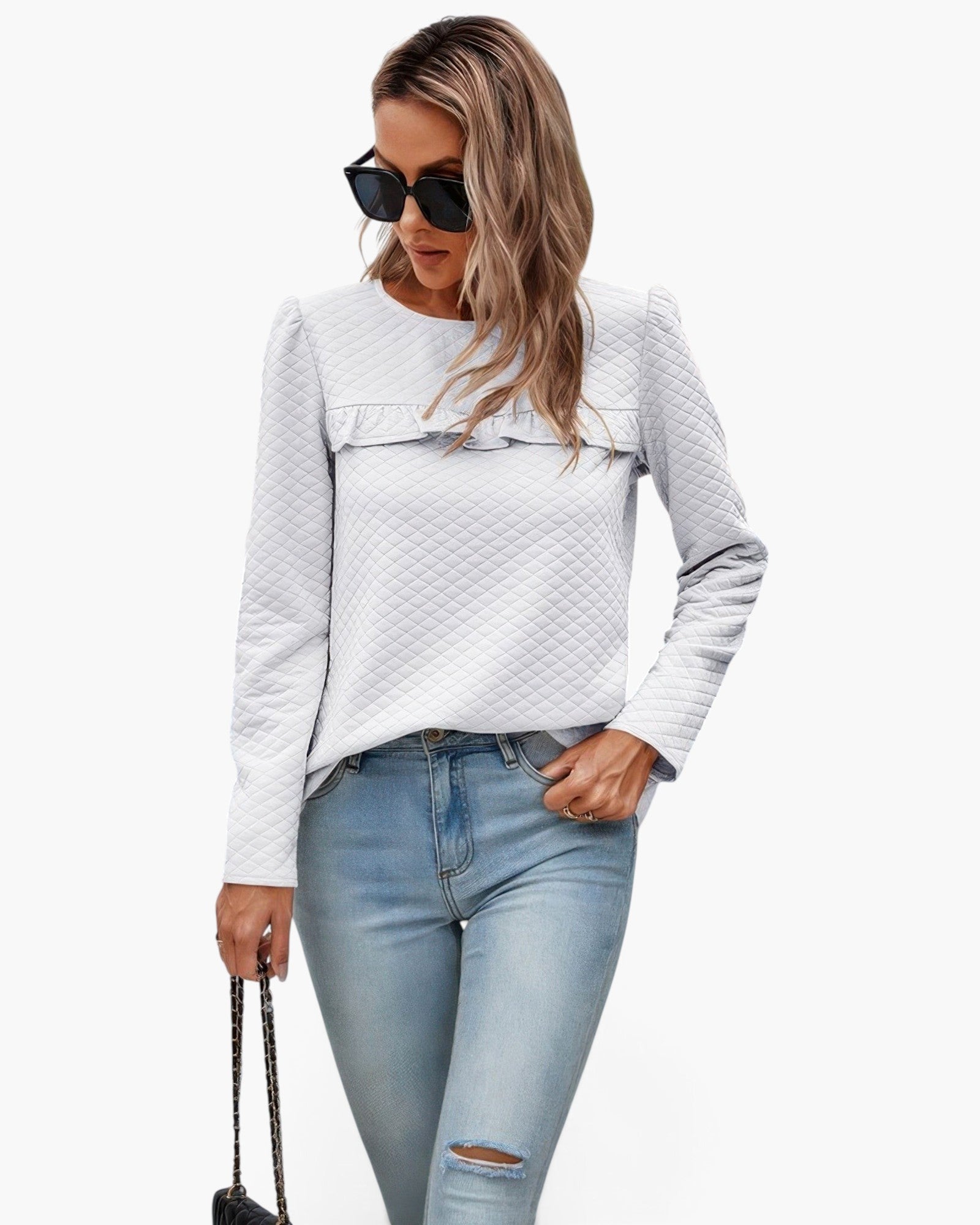Beach Rose Co. white quilted crewneck pullover with ruffle detail on the chest and back, worn with light blue jeans.