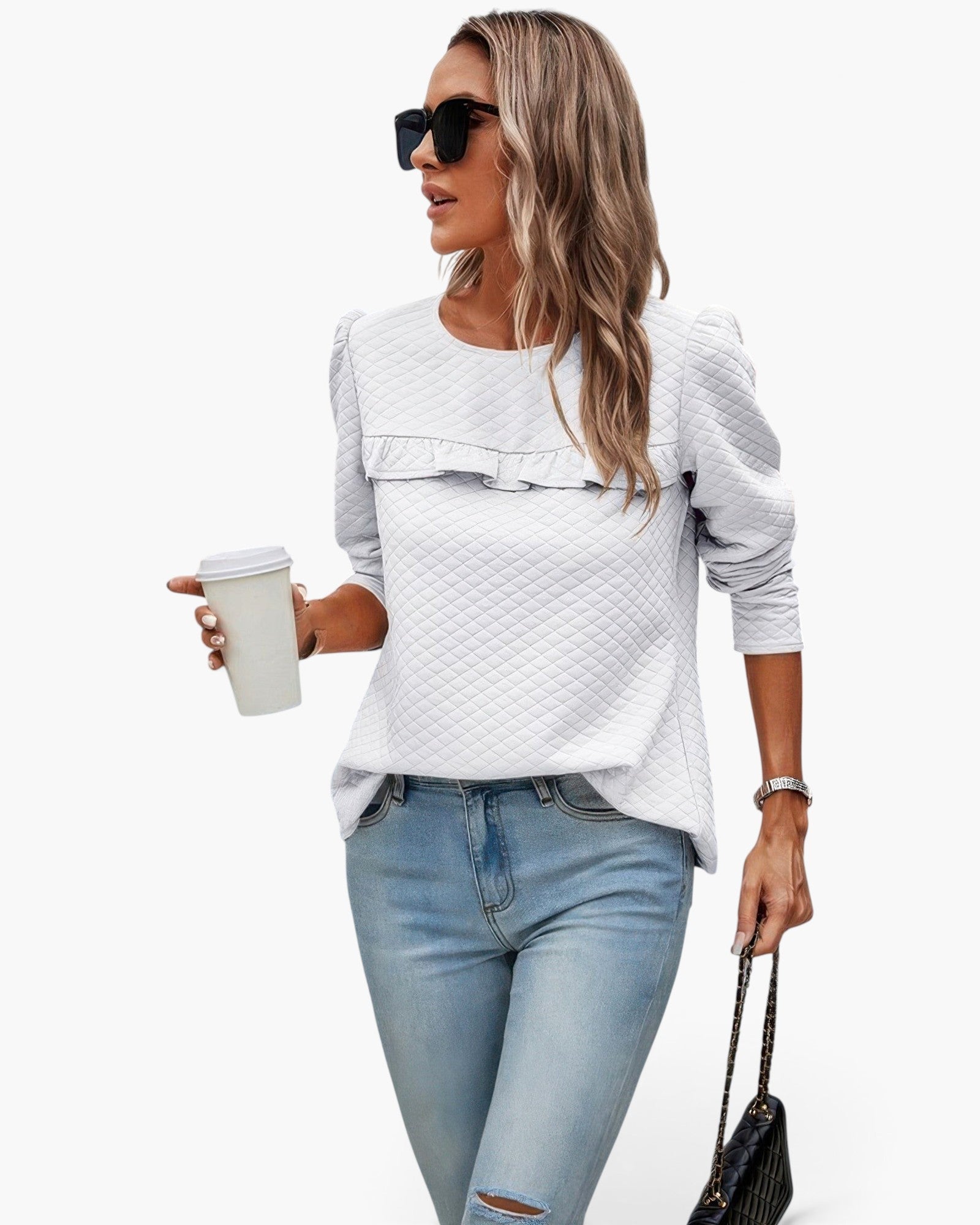 Beach Rose Co. white quilted crewneck pullover with ruffle detail worn by a woman with sunglasses and jeans