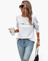 Beach Rose Co. white quilted crewneck pullover with ruffle detail worn by a woman with sunglasses and jeans