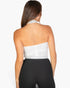 Beach Rose Co. white ribbed halter neck backless top worn by a woman, showing the back view.