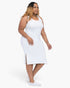Beach Rose Co. plus size white ribbed tank midi dress with side slits worn by a woman with blonde highlights