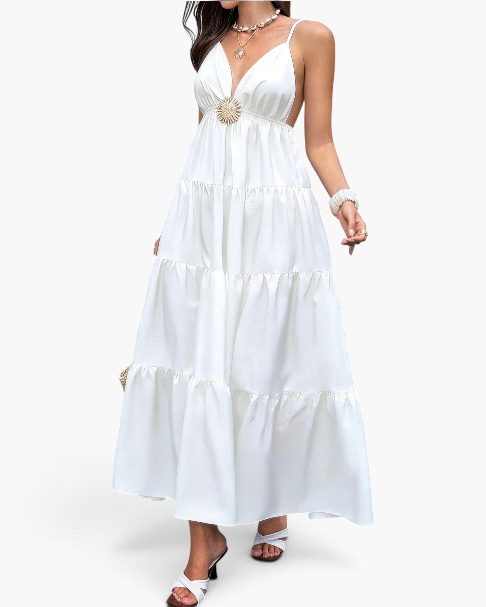 Beach Rose Co. white sleeveless maxi dress with high waist, open back, and gold ring detail, worn by a woman.