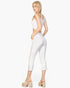 Beach Rose Co. white cropped pants with slit hem detail worn by a blonde model in a white crop top and platform heels