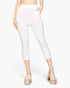Beach Rose Co. white cropped pants in stretch crepe fabric with a slit hem and elasticized waist on a model.