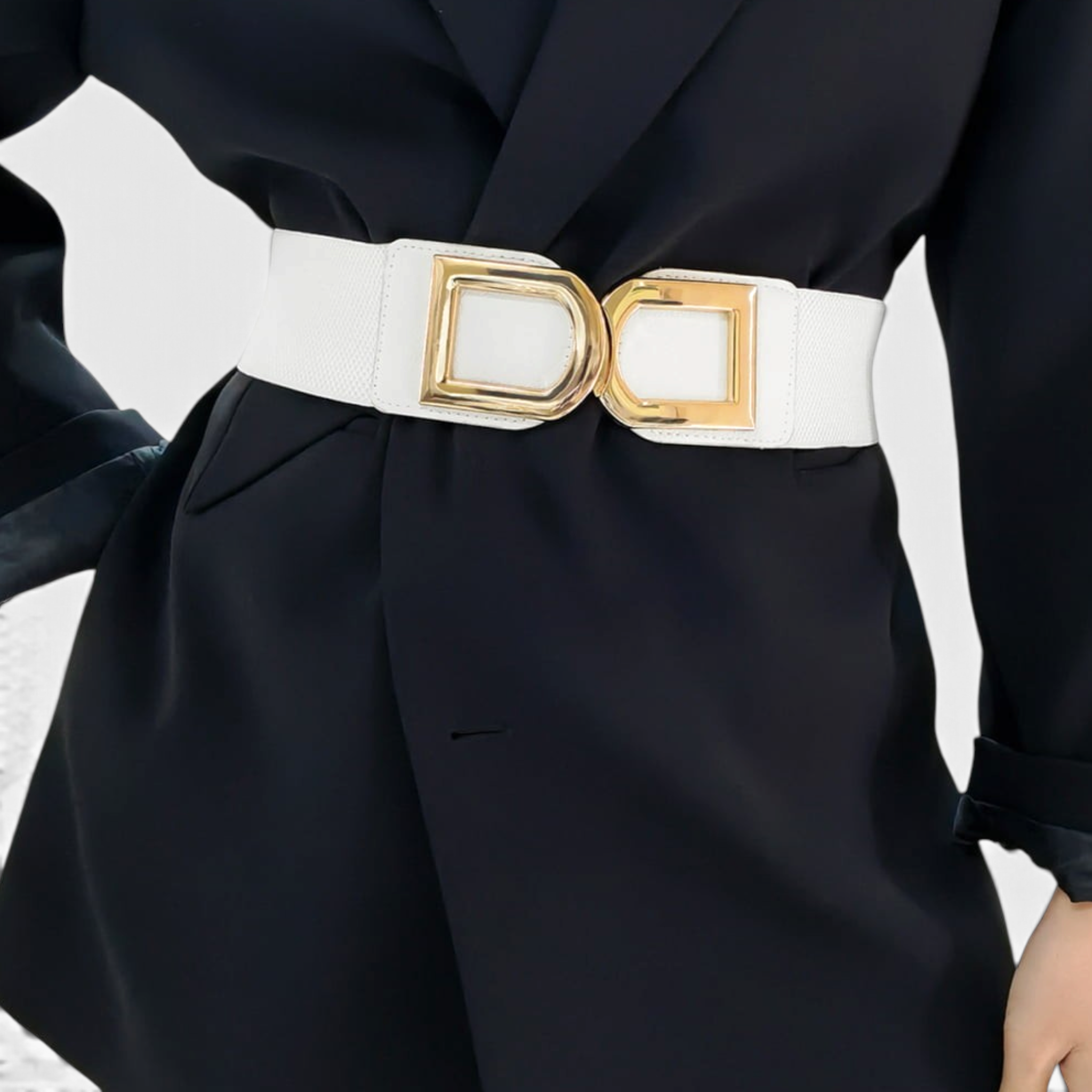 Beach Rose Co. white stretch waist belt with a polished gold-tone double-D buckle worn over a black blazer