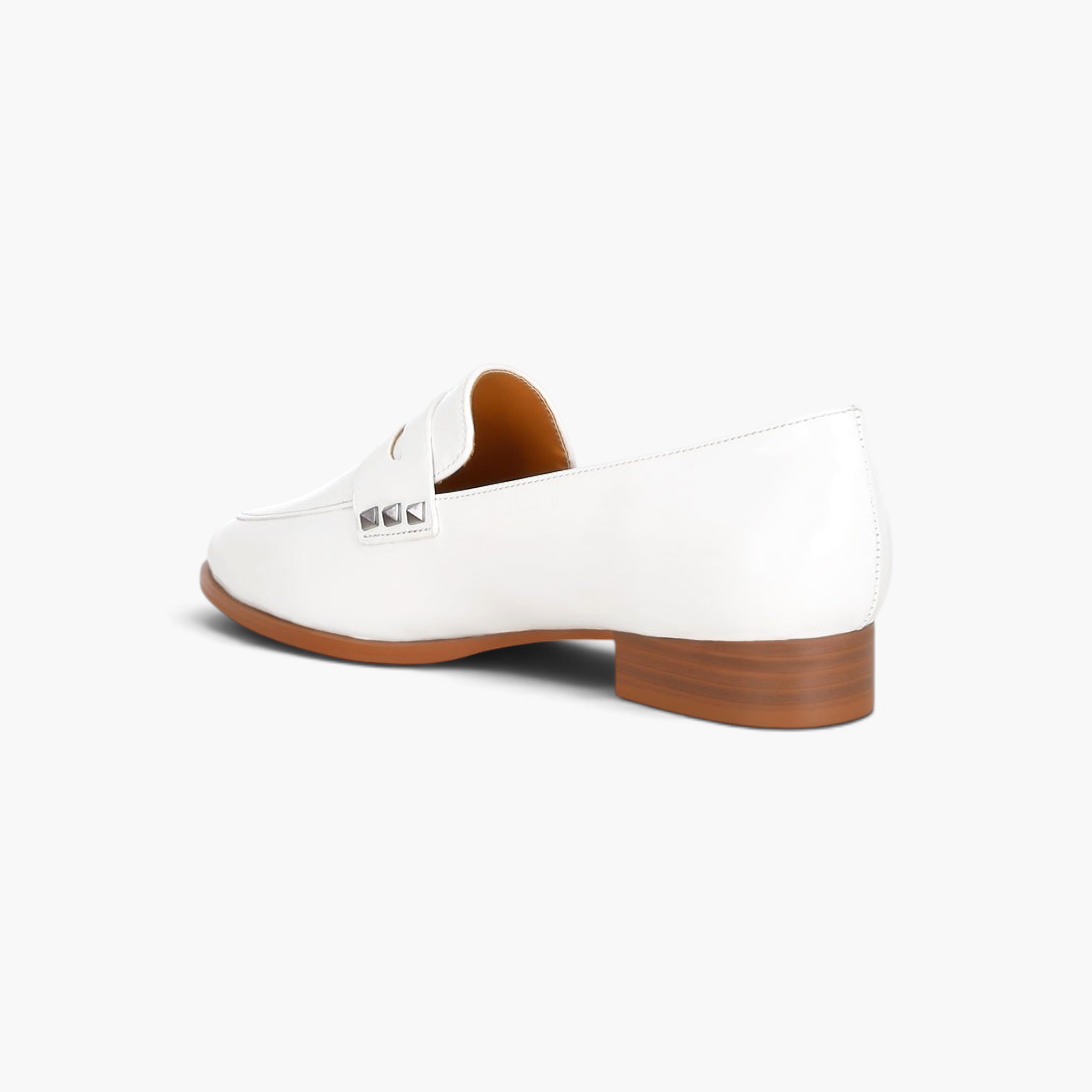 Beach Rose Co. white patent pleather penny loafers with silver stud accents on the strap and a low block heel.