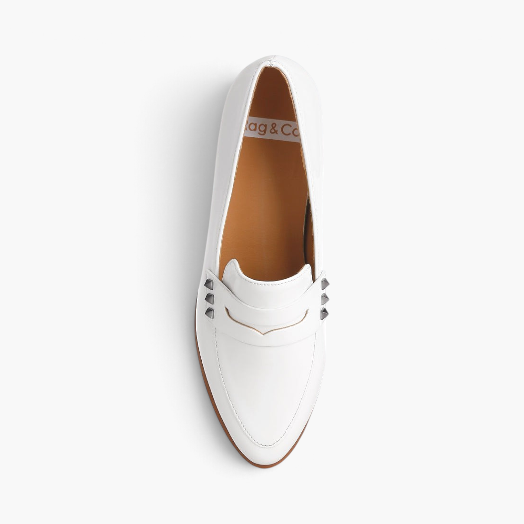 Beach Rose Co. white patent pleather penny loafers with silver stud accents and a closed almond toe, top view.
