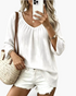 Beach Rose Co. white textured V-neck blouse with loose three-quarter sleeves and a relaxed fit.
