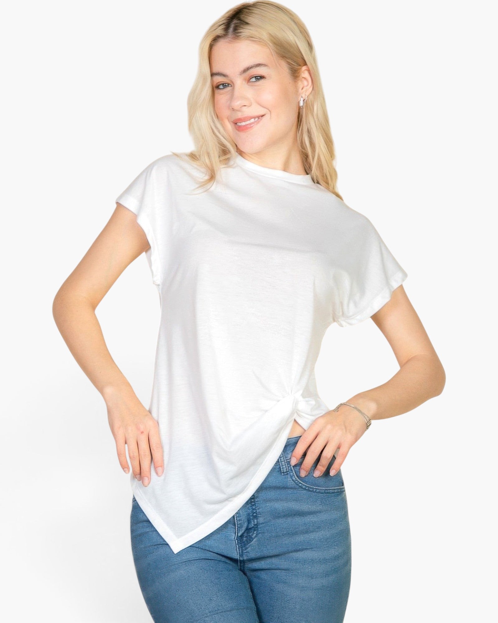 Beach Rose Co. white batwing sleeve tee with a twist front detail worn by a blonde model with blue jeans