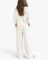Beach Rose Co. white waffle knit two-piece lounge set with long sleeves and wide-leg pants, back view