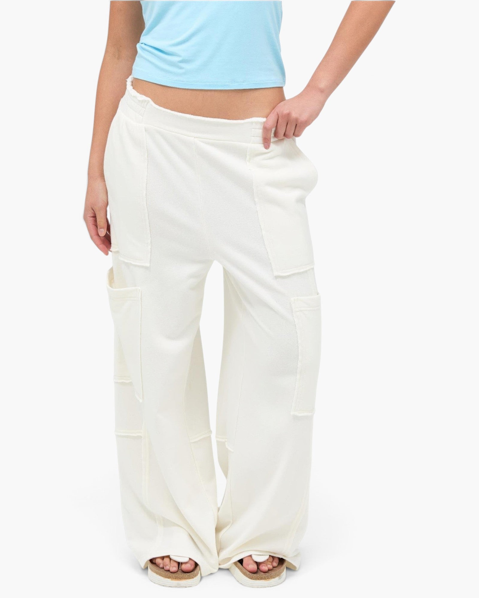 Beach Rose Co. white mineral wash wide leg cargo pants with raw edge patch pockets and high-rise elastic waistband