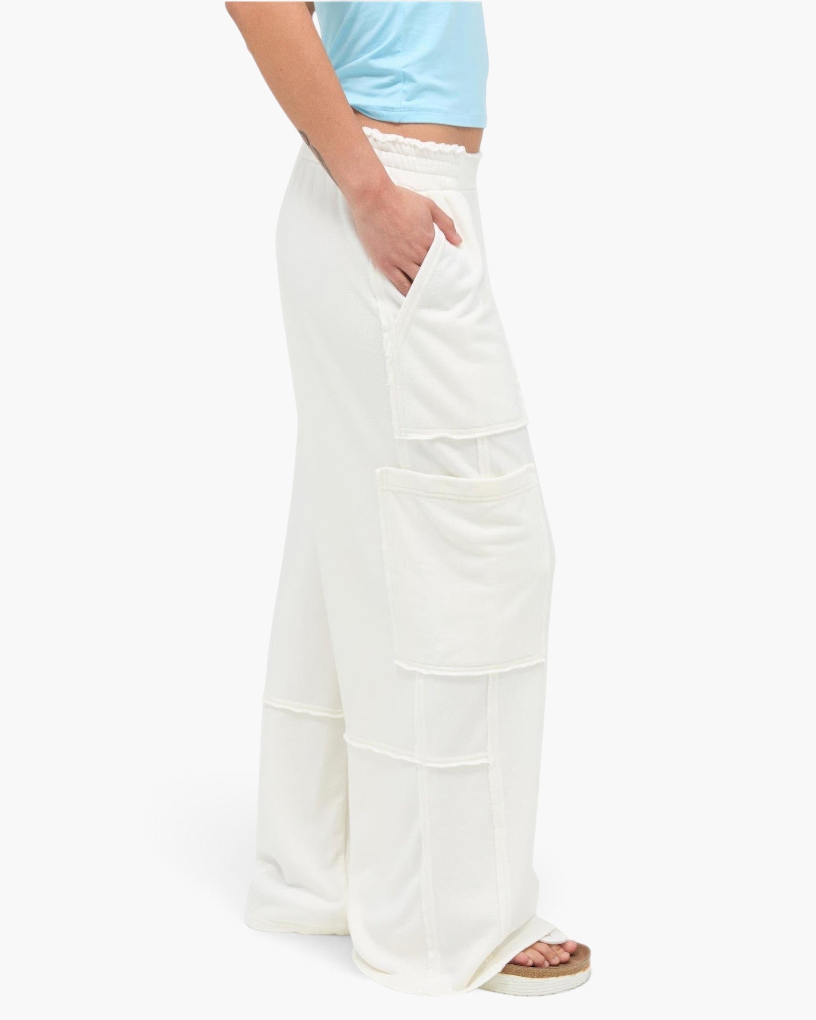Beach Rose Co. white mineral wash wide leg cargo pants with raw edge patch pockets and high-rise elastic waistband