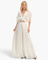 Beach Rose Co. white two-piece set with a collared cropped wrap top and flowing pleated wide-leg pants on a model.