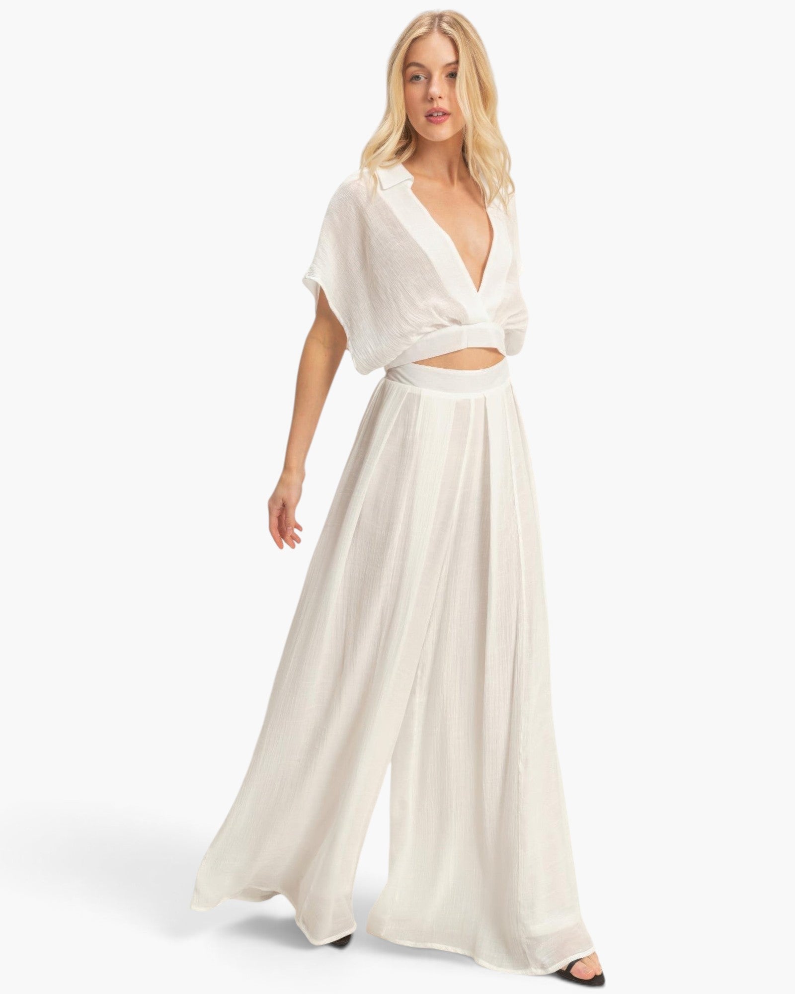 Beach Rose Co. white cotton-blend two-piece set with a collared cropped wrap top and flowing wide-leg pleated pants.