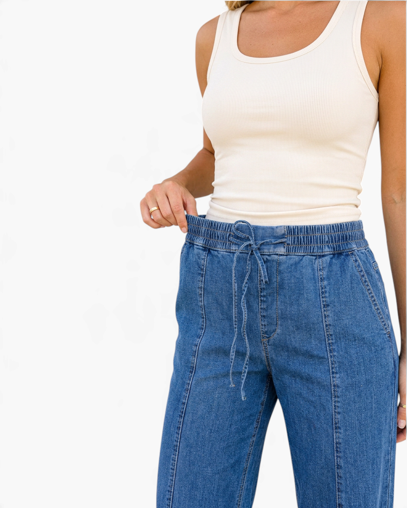 Beach Rose Co. medium wash wide leg jeans with an elastic drawstring waistband and vertical front seam details.