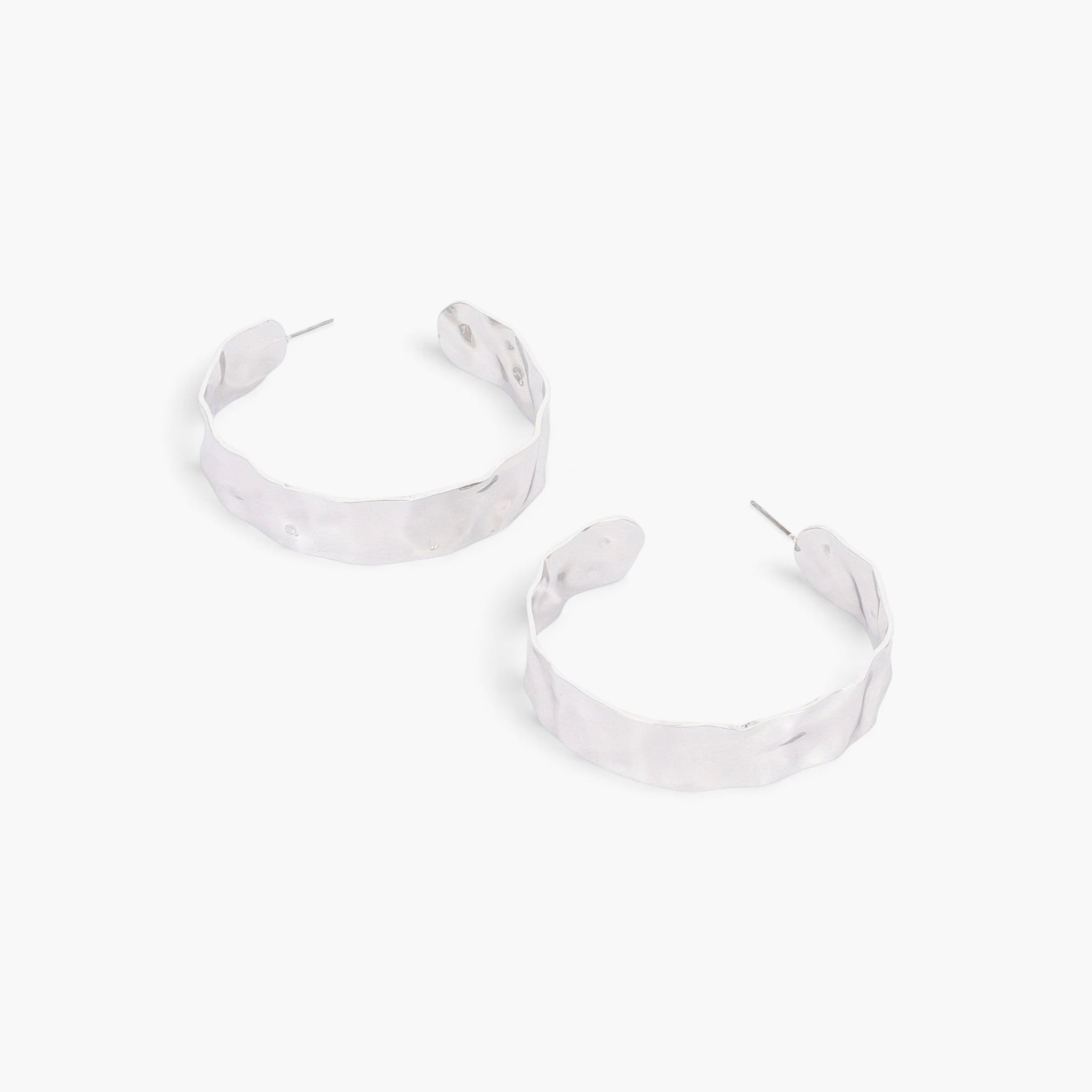 Beach Rose Co. wide silver-tone metal hoop earrings with a textured, organic finish on a clean white background.