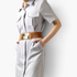 Beach Rose Co. wide stretch belt with a gold geometric buckle and tan PU accents worn over a light grey shirt dress.