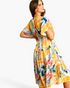 Beach Rose Co. yellow multicolor abstract print midi dress with flutter sleeves and a tiered ruffled skirt