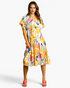 Beach Rose Co. yellow multicolor abstract print midi dress with flutter sleeves and a tiered ruffled skirt on a model